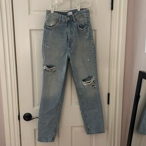 Light wash straight leg ripped jeans